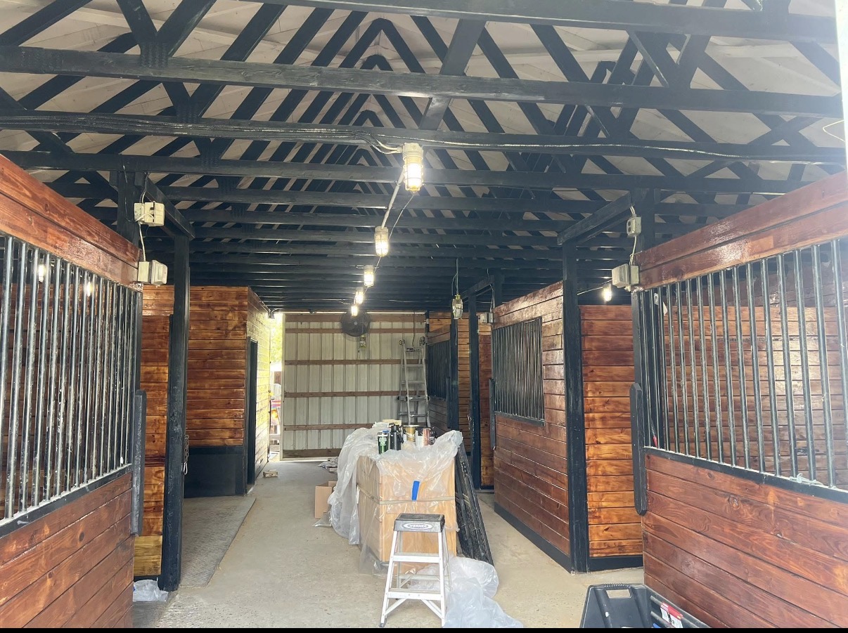 Freshly stained and painted barn stall interior