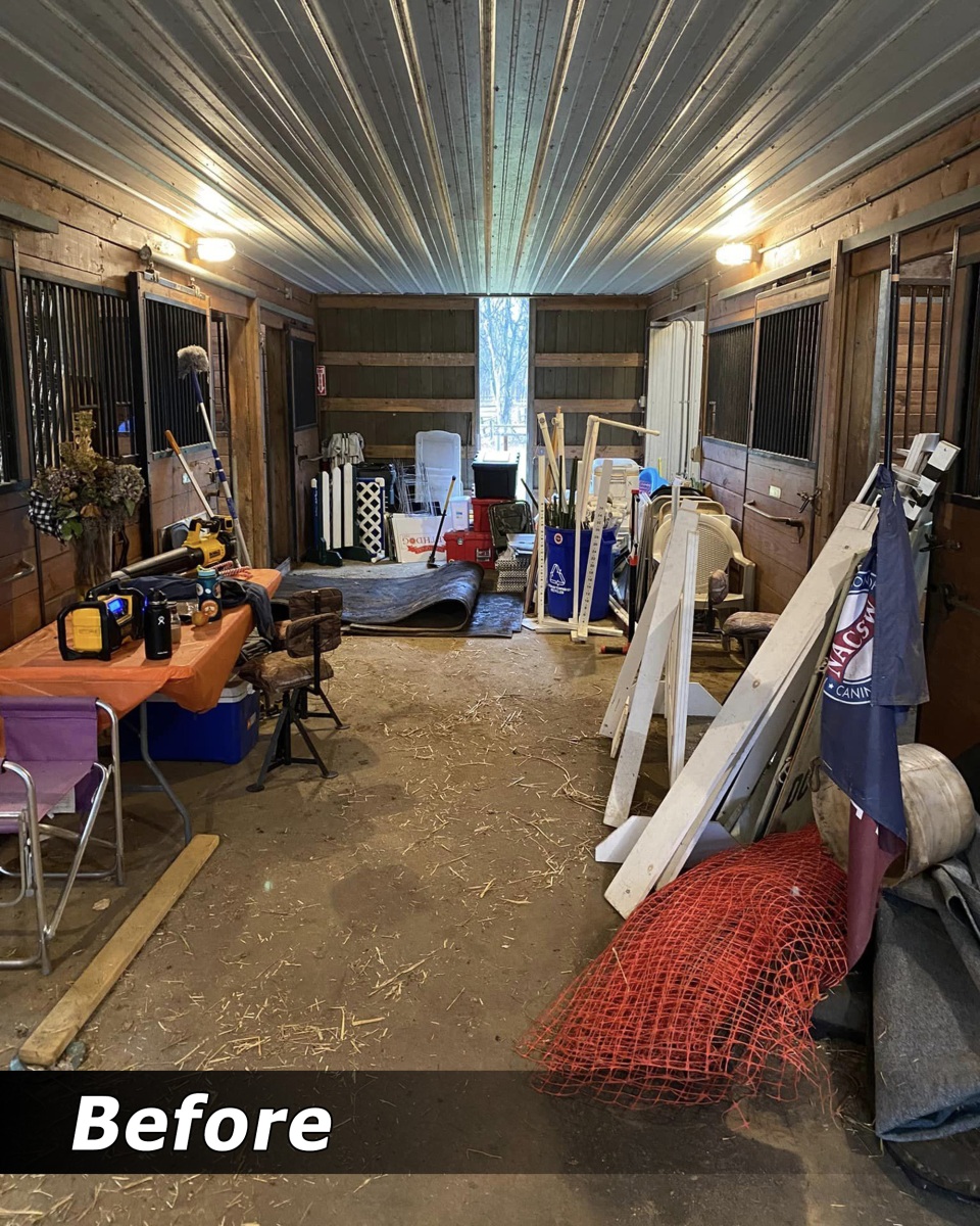Cluttered barn aisle before cleanout
